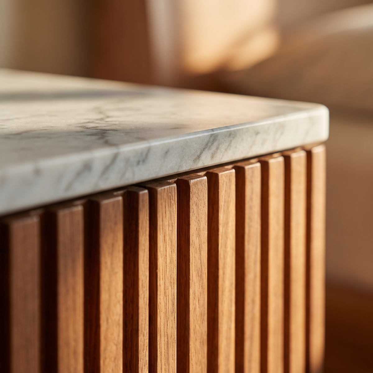 Makena Nightstand - detail of the marble top meeting the reeded walnut body