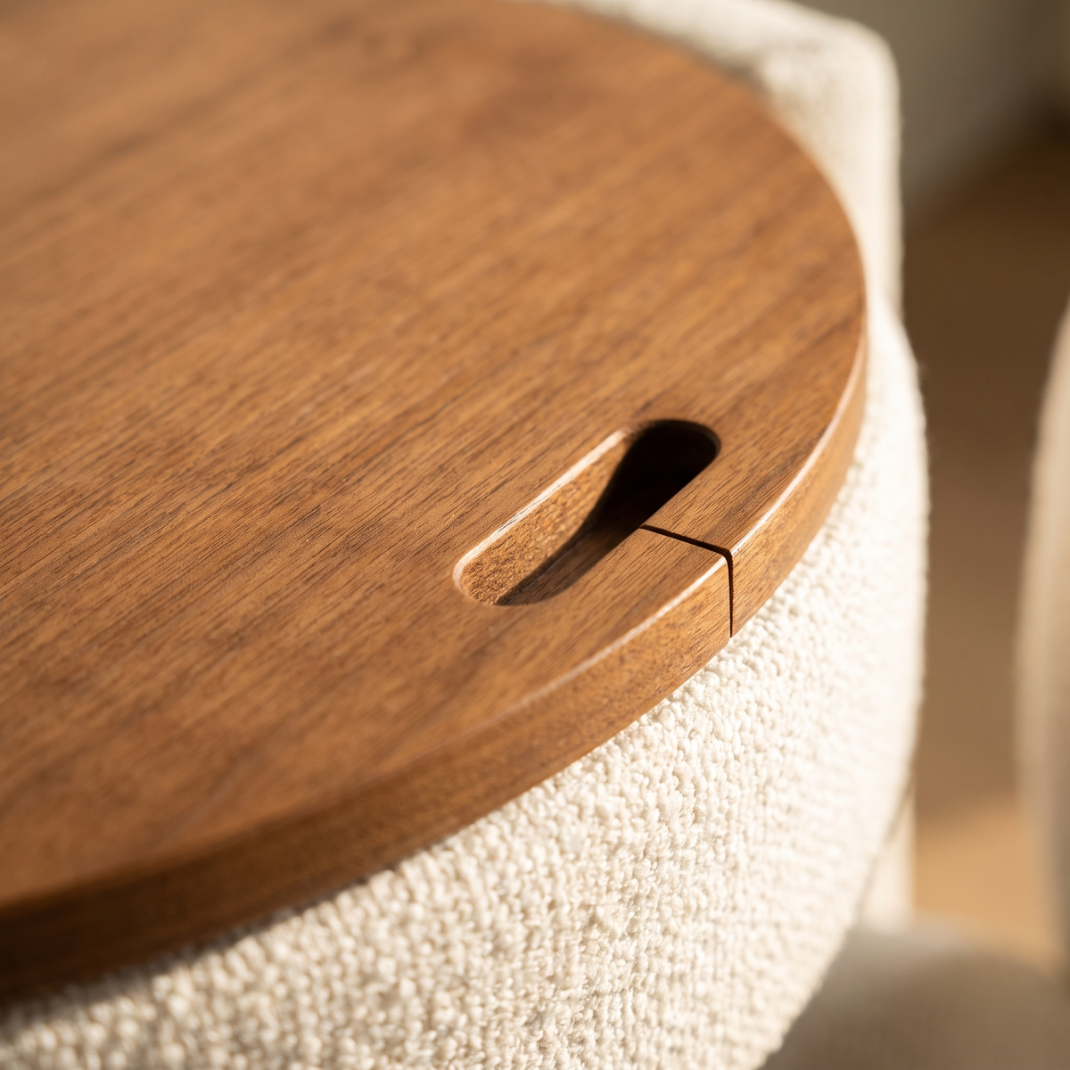 Laie Round Vanity - detail of the walnut lid, its finger cutout and the boucle rim