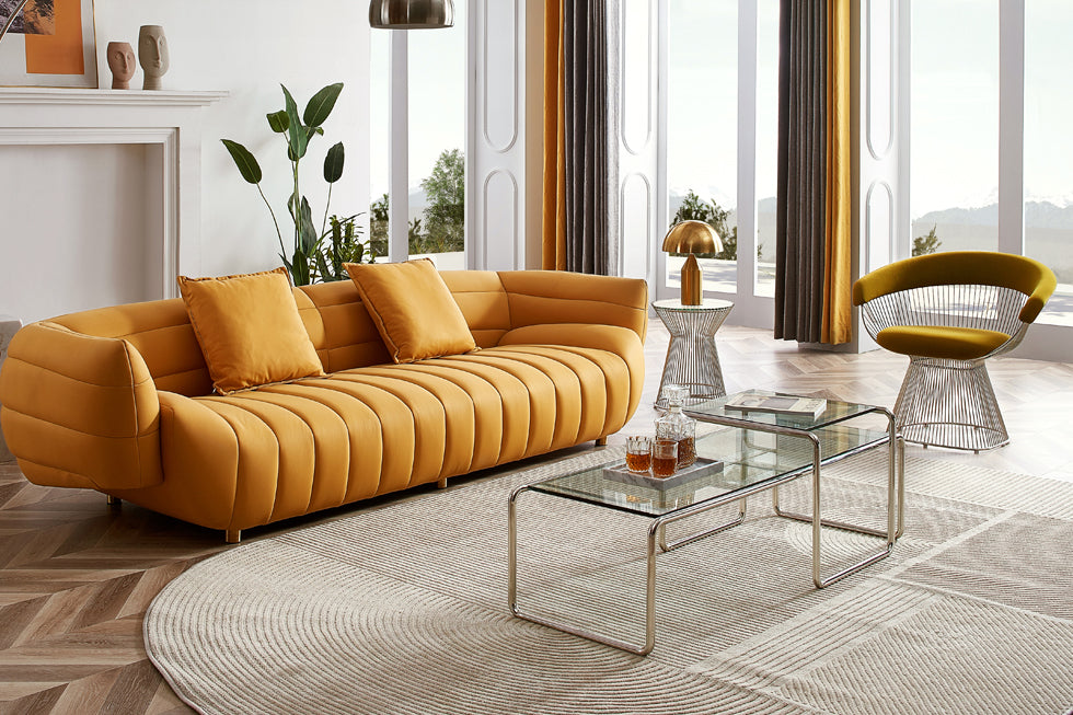 A living room interior design set with a bright yellow modern couch and glass coffee table.