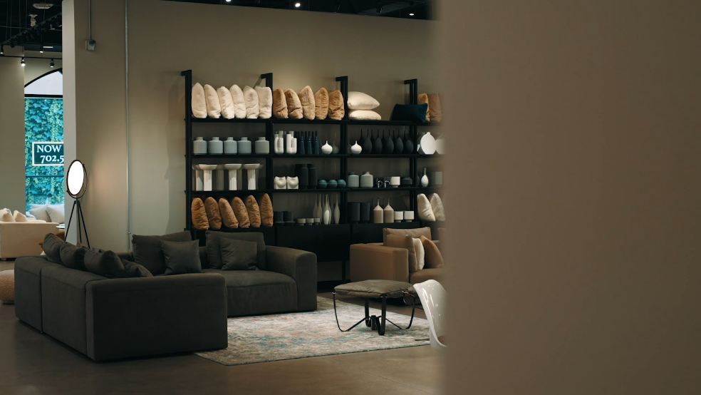 Inside look at Valyou furniture store modern designs including sectionals and home decor on display.